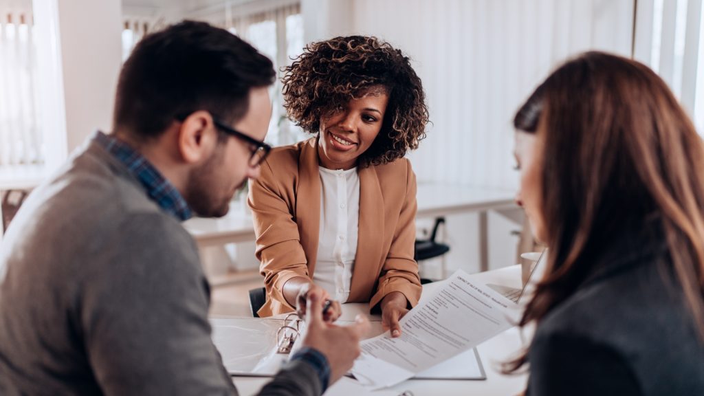 A couple deciding between conventional vs. fha financing